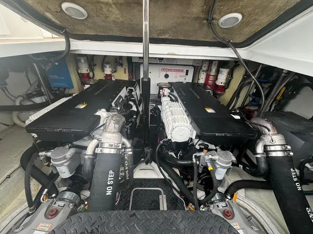 Slide: The Image of Engine compartment of a 2013 Formula 40pc boat, showcasing dual engines and mechanical components. - 20