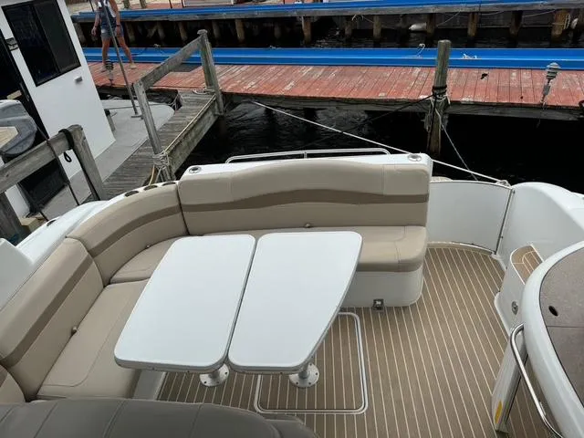 Slide: The Image of 2013 Formula 40pc yacht with beige seating and dual tables on deck. - 22