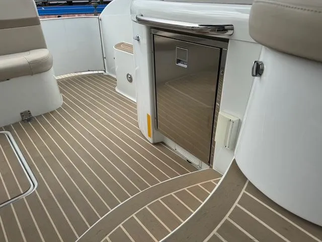 Slide: The Image of 2013 Formula 40pc boat interior with sleek flooring and stainless steel cabinetry. - 26