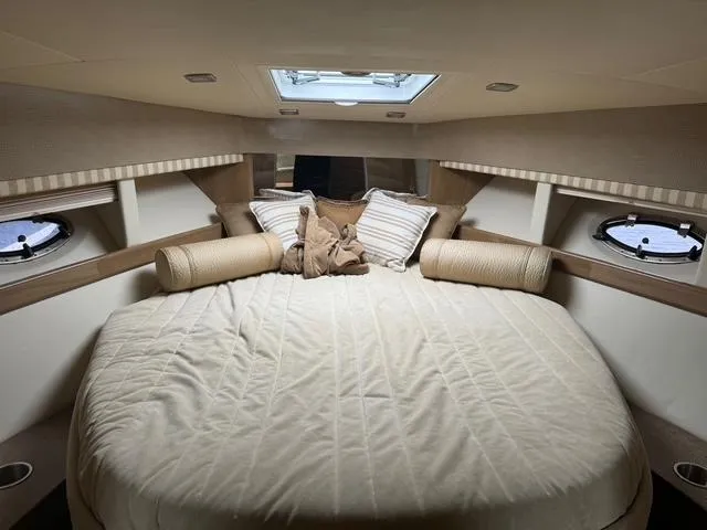 Slide: The Image of Luxurious cabin interior of a 2013 Formula 40pc yacht with cozy bedding. - 28
