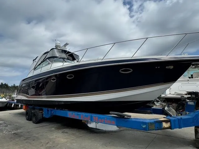 Slide: The Image of 2013 Formula 40pc yacht on trailer at marina, under cloudy sky. - 3