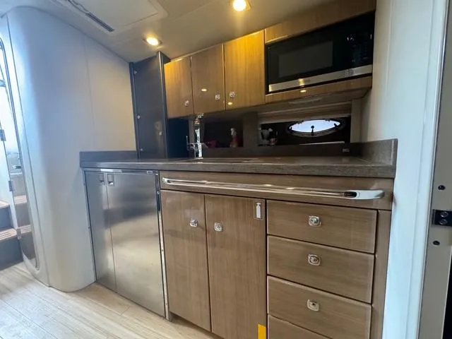 Slide: The Image of Modern kitchen in 2013 Formula 40pc yacht with wood cabinets and stainless steel appliances. - 31