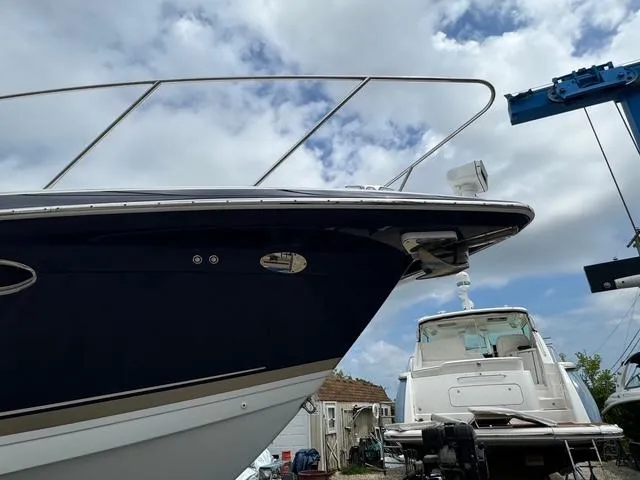 Slide: The Image of 2013 Formula 40pc boat, docked with a clear sky background. - 4