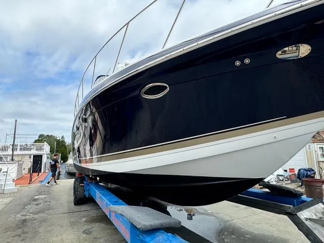 Slide: The Image of 2013 Formula 40pc boat on trailer, side view, outdoors. - 5