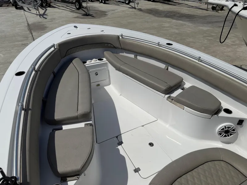 Slide: The Image of 2021 Sportsman Open 282 boat interior with cushioned seating and storage compartments. - 5