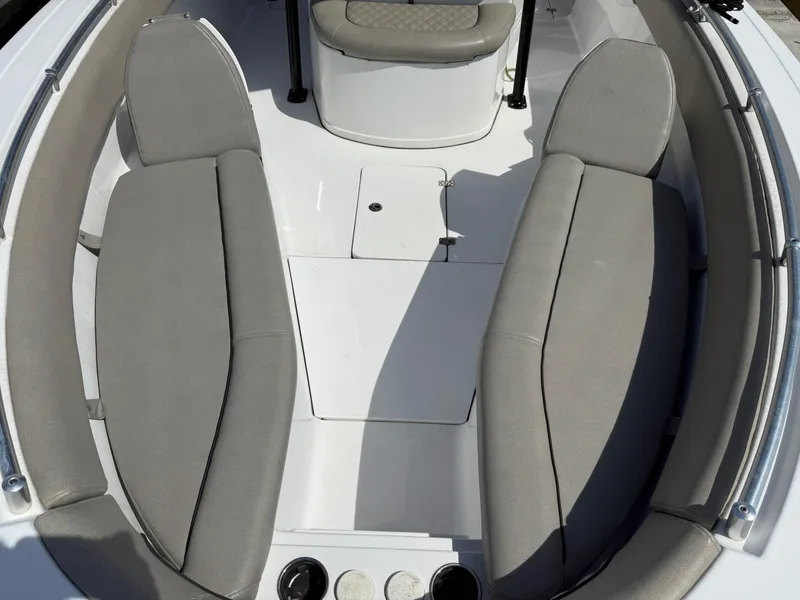Slide: The Image of 2021 Sportsman Open 282 boat interior with gray cushioned seating. - 6