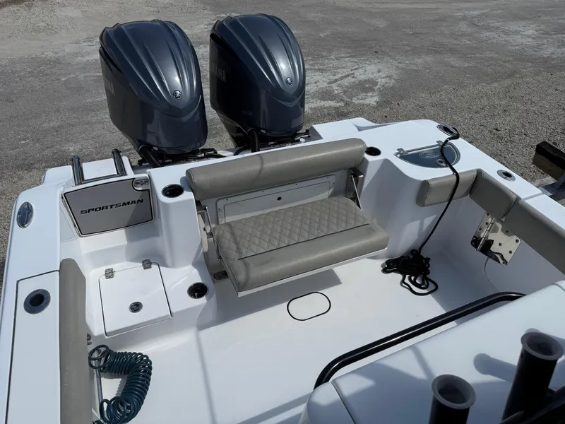 Slide: The Image of 2021 Sportsman Open 282 boat with dual engines and cushioned seating. - 8