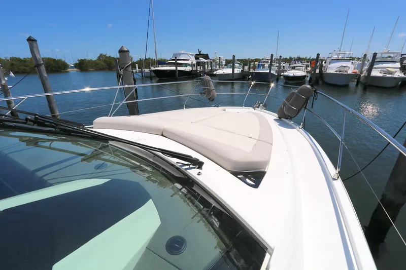 Slide: The Image of 2019 Beneteau Gran Turismo 50 yacht docked at a marina under clear blue skies. - 16