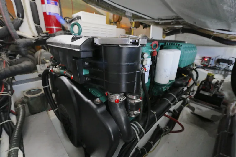 Slide: The Image of Engine room of 2019 Beneteau Gran Turismo 50 yacht, showcasing detailed machinery components. - 20