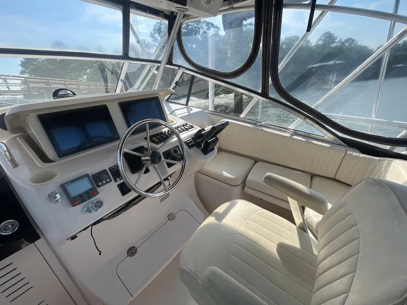 Slide: The Image of 2002 Grady-White Express 330 helm with dual screens and leather seating. - 6