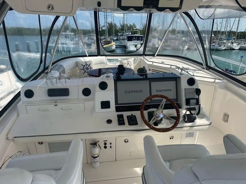 Slide: The Image of Helm of 2006 Sea Ray 58 Sedan Bridge with Garmin navigation, marina view. - 10