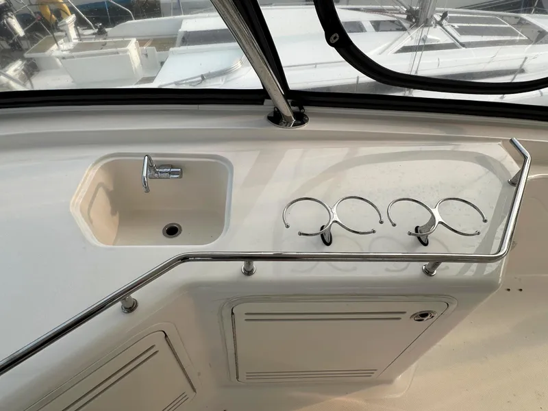 Slide: The Image of 2006 Sea Ray 58 Sedan Bridge yacht sink and cup holders on deck. - 12