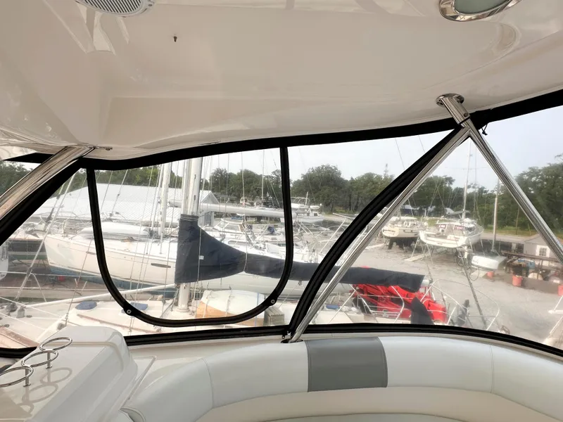 Slide: The Image of Interior view of 2006 Sea Ray 58 Sedan Bridge yacht overlooking marina. - 13