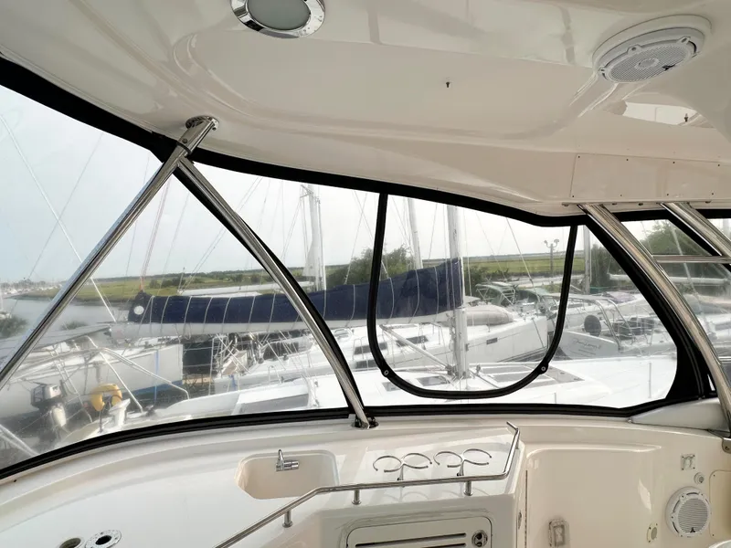 Slide: The Image of Interior view of 2006 Sea Ray 58 Sedan Bridge yacht with marina backdrop. - 14