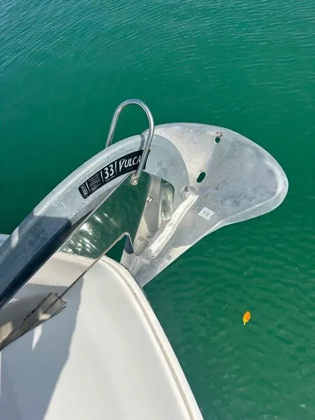 Slide: The Image of Anchor of 2006 Sea Ray 58 Sedan Bridge in clear water. - 2