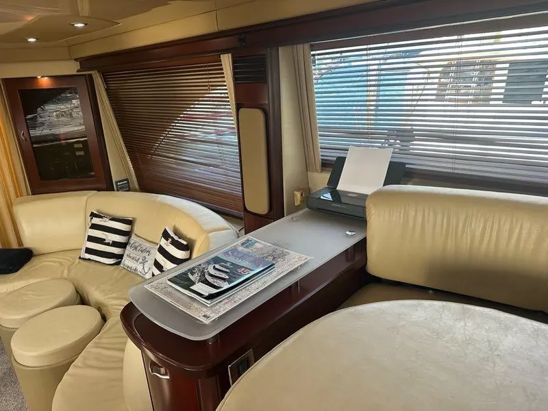 Slide: The Image of Luxurious interior of 2006 Sea Ray 58 Sedan Bridge yacht with leather seating and striped pillows. - 23
