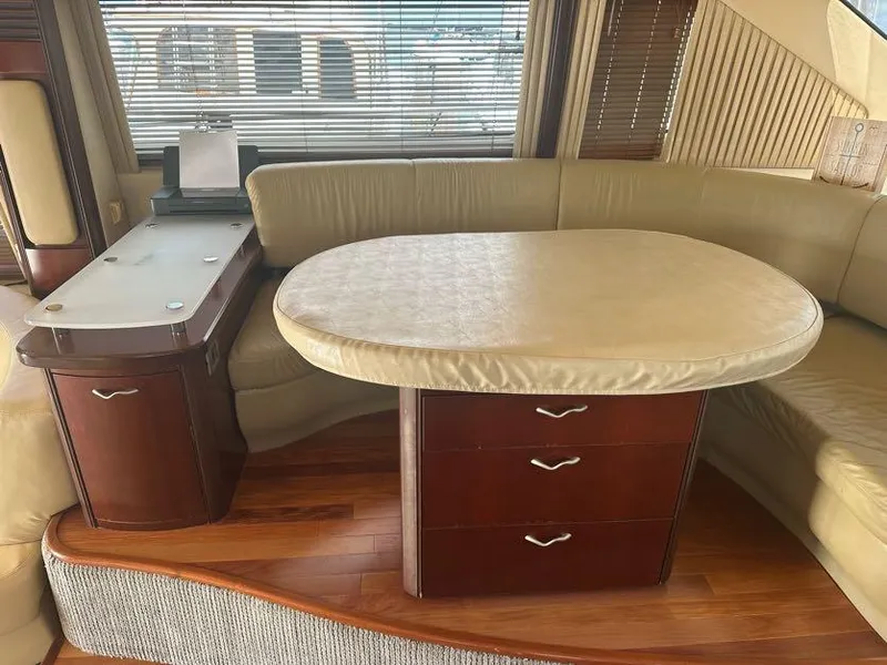 Slide: The Image of Luxurious interior of 2006 Sea Ray 58 Sedan Bridge yacht with elegant dining area. - 29