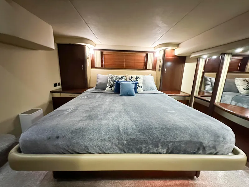 Slide: The Image of Luxurious bedroom interior of 2006 Sea Ray 58 Sedan Bridge yacht with plush bedding. - 30