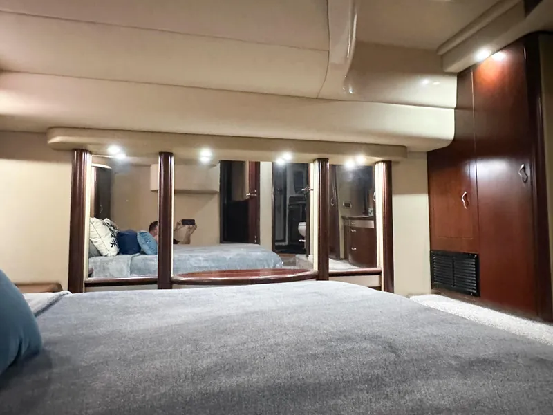 Slide: The Image of Luxurious interior of 2006 Sea Ray 58 Sedan Bridge yacht with elegant wood finishes. - 31