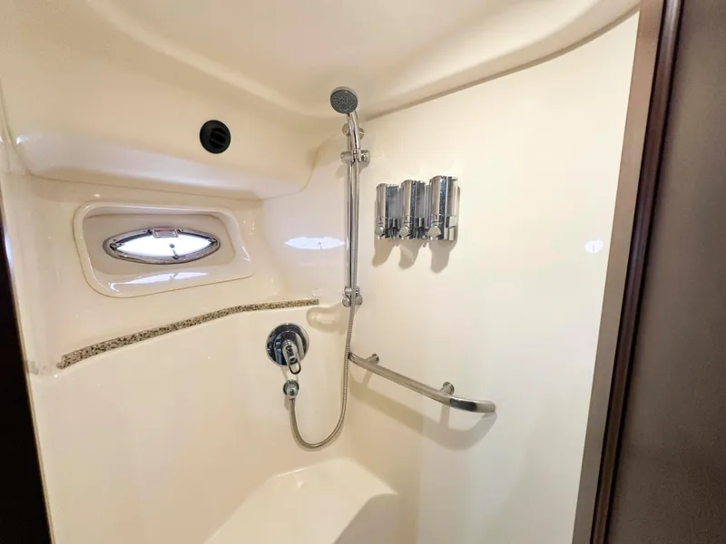 Slide: The Image of Shower area in 2006 Sea Ray 58 Sedan Bridge yacht with window and fixtures. - 37