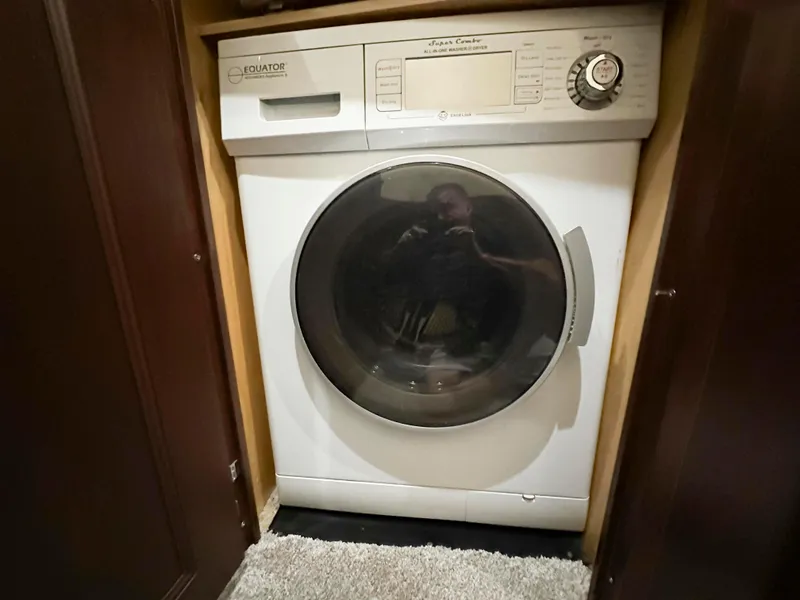 Slide: The Image of Front-loading washer in 2006 Sea Ray 58 Sedan Bridge yacht interior. - 40