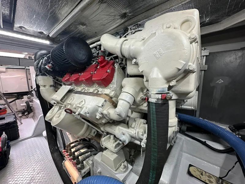 Slide: The Image of Engine room of 2006 Sea Ray 58 Sedan Bridge, showcasing a powerful marine engine. - 44