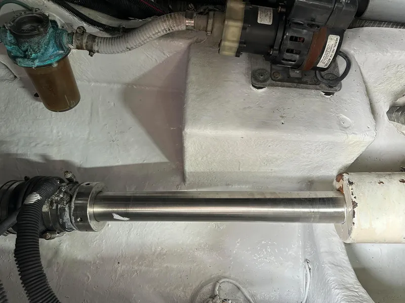 Slide: The Image of Engine compartment of a 2006 Sea Ray 58 Sedan Bridge yacht, showing mechanical components. - 49