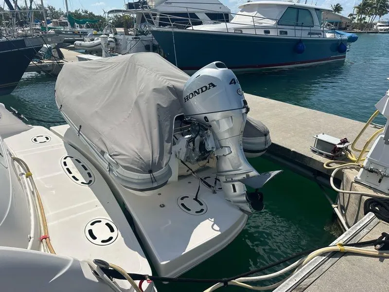 Slide: The Image of Docked 2006 Sea Ray 58 Sedan Bridge with covered dinghy and Honda outboard motor. - 5