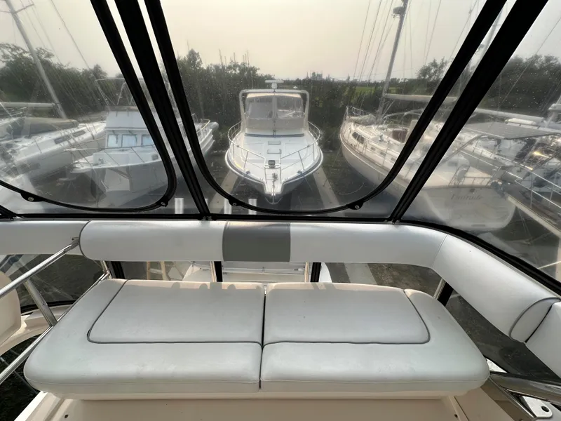 Slide: The Image of 2006 Sea Ray 58 Sedan Bridge interior with panoramic marina view. - 7