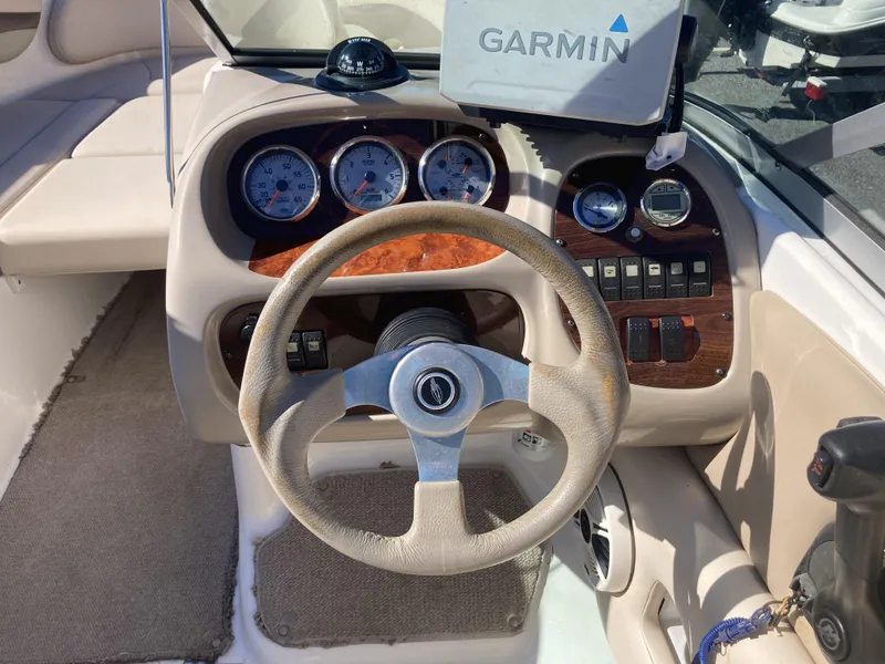 Slide: The Image of 2008 Chaparral 210 SSi boat dashboard with Garmin GPS and wood accents. - 4