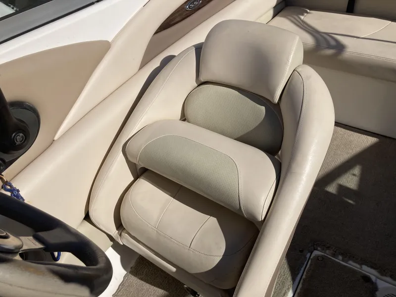 Slide: The Image of 2008 Chaparral 210 SSi boat interior with beige leather seating. - 5