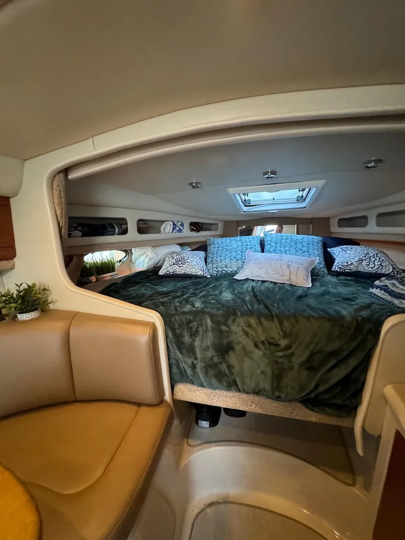 Slide: The Image of Interior of 2003 Chaparral Signature 280 boat with cozy sleeping area. - 12