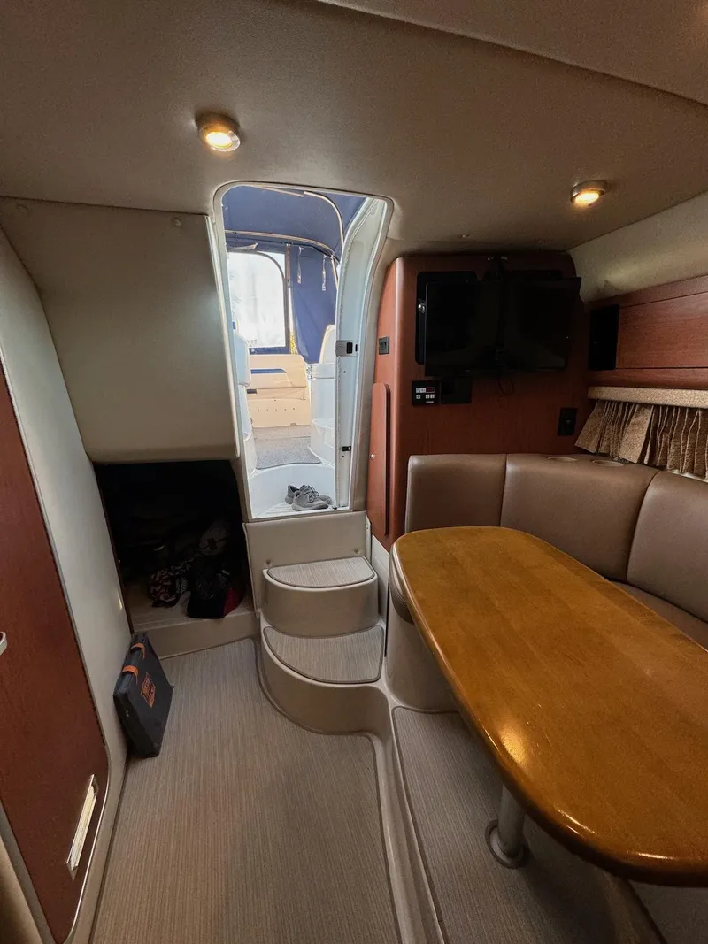 Slide: The Image of Interior of 2003 Chaparral Signature 280 boat with seating and table. - 17