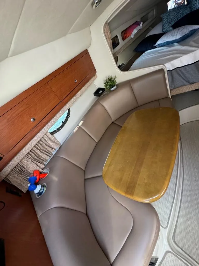 Slide: The Image of Interior of 2003 Chaparral Signature 280 boat with seating and table. - 19