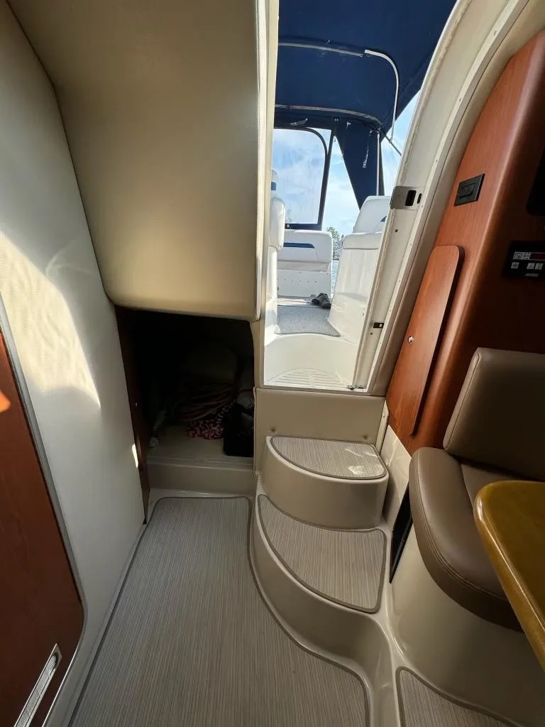 Slide: The Image of Interior view of 2003 Chaparral Signature 280 boat, featuring steps and seating area. - 22