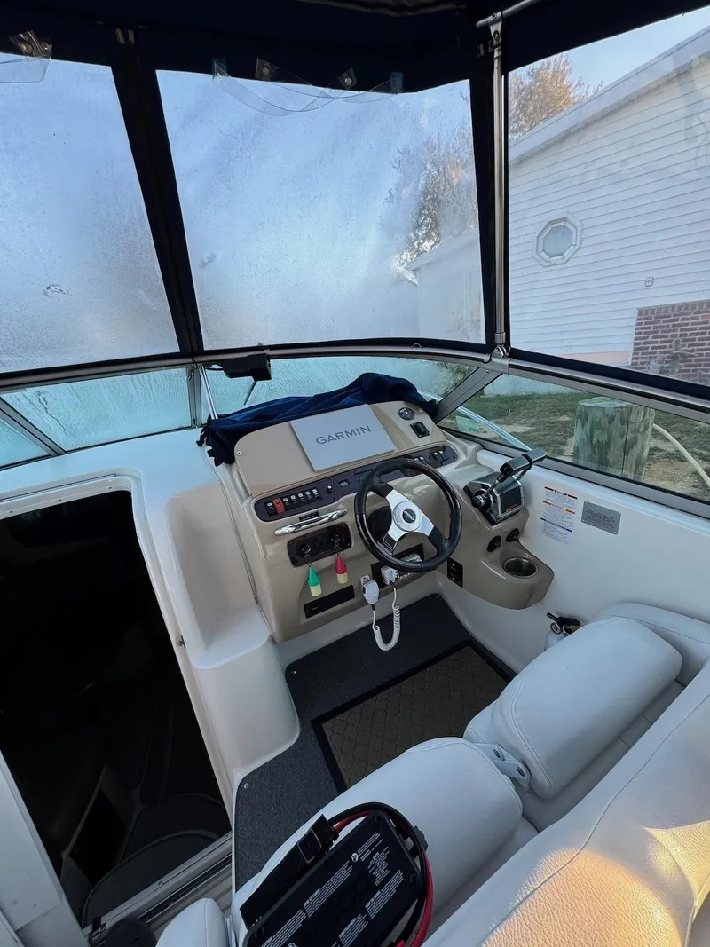 Slide: The Image of 2003 Chaparral Signature 280 boat cockpit with steering wheel and control panel. - 8