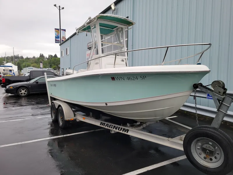 Slide: The Image of 2006 Sea Pro 196 Center Console boat on trailer in parking lot. - 1