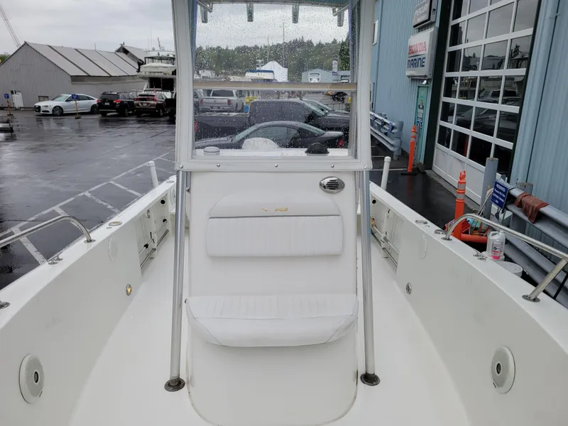 Slide: The Image of 2006 Sea Pro 196 Center Console boat at a marina, showcasing seating and console. - 16
