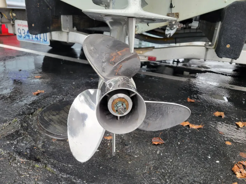 Slide: The Image of Propeller of a 2006 Sea Pro 196 Center Console boat on wet pavement. - 6