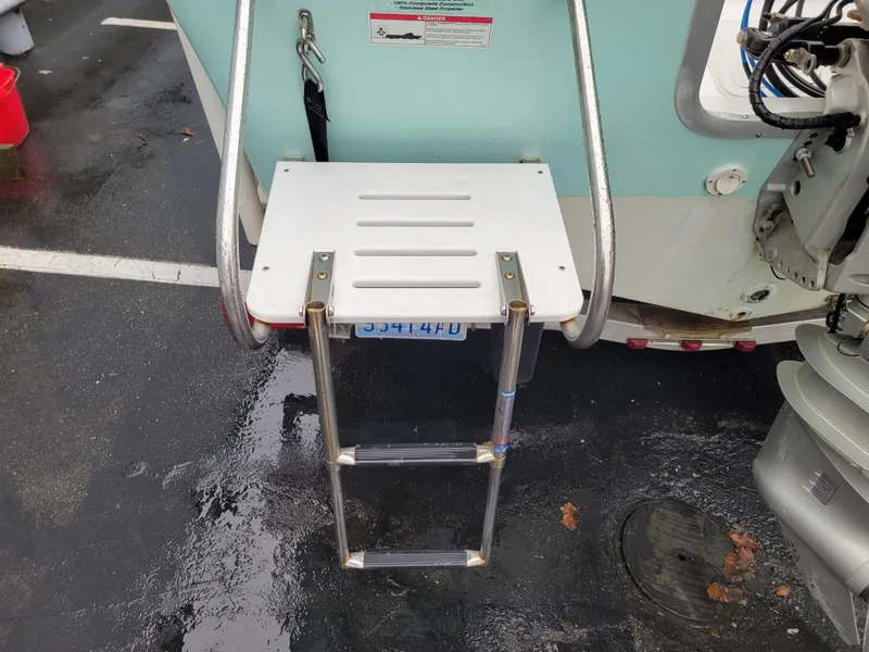 Slide: The Image of 2006 Sea Pro 196 Center Console boat with a foldable swim ladder. - 7