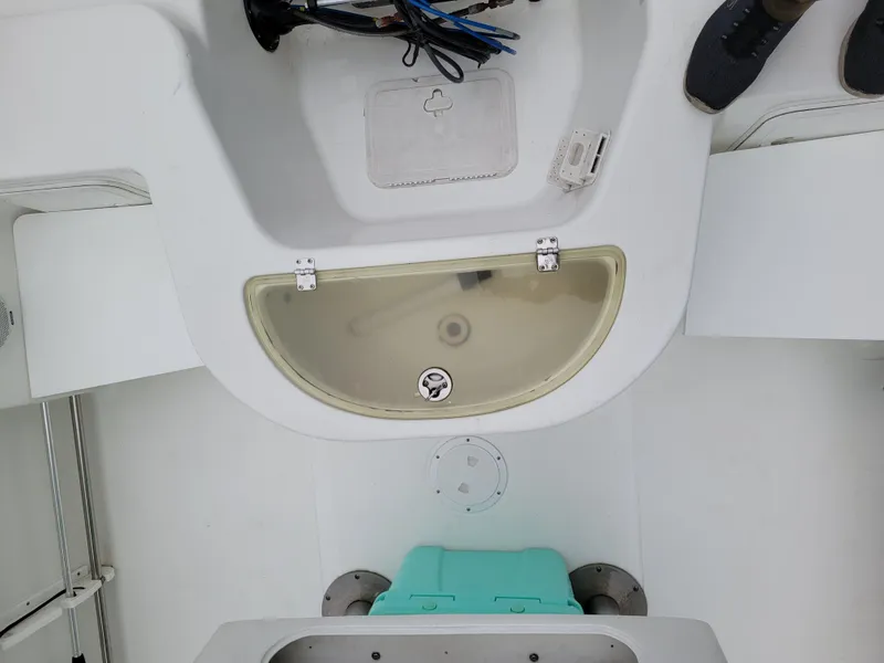 Slide: The Image of 2006 Sea Pro 196 Center Console boat interior with storage compartments and seating. - 9