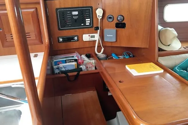 Slide: The Image of 2001 Beneteau 361 yacht interior with navigation station and wooden cabinetry. - 10