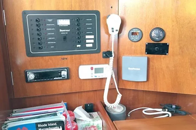Slide: The Image of Control panel of a 2001 Beneteau 361 sailboat with navigation and communication equipment. - 12