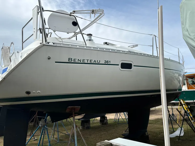 Slide: The Image of 2001 Beneteau 361 sailboat on stands, side view, outdoors. - 4