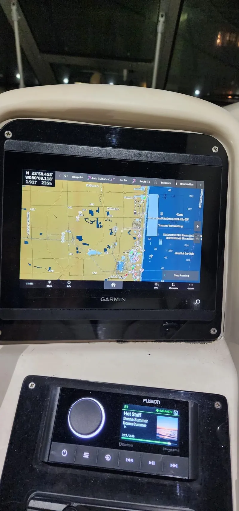 Slide: The Image of Garmin navigation system on a 2004 Sea Ray 340 Sundancer boat dashboard. - 24