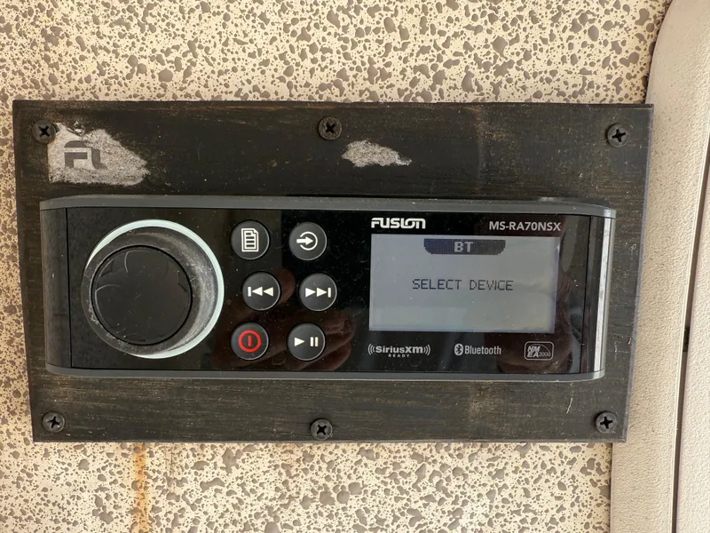 Slide: The Image of Fusion MS-RA70NSX stereo system on a 2007 Wellcraft 352 Tournament boat dashboard. - 20
