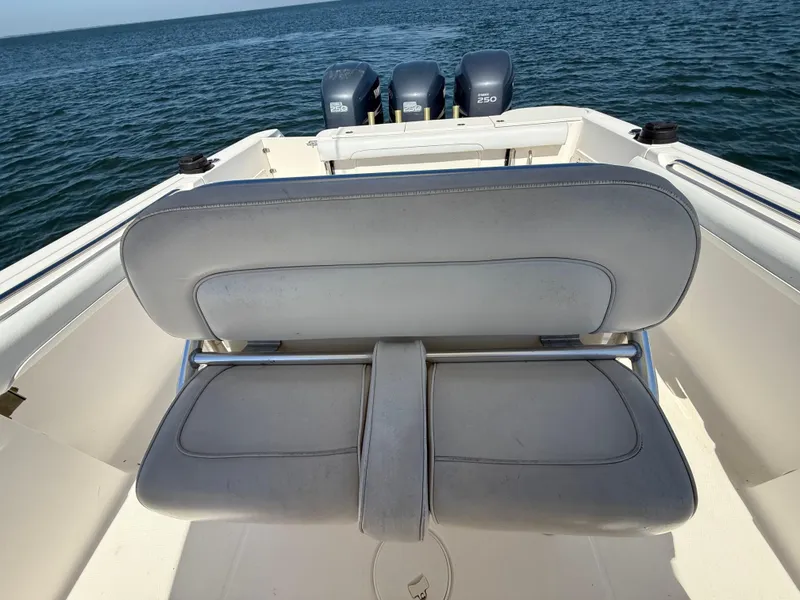Slide: The Image of 2007 Wellcraft 352 Tournament boat with triple outboard engines on open water. - 24