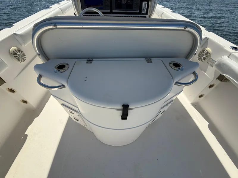Slide: The Image of 2007 Wellcraft 352 Tournament boat interior with storage compartment and cup holders. - 26