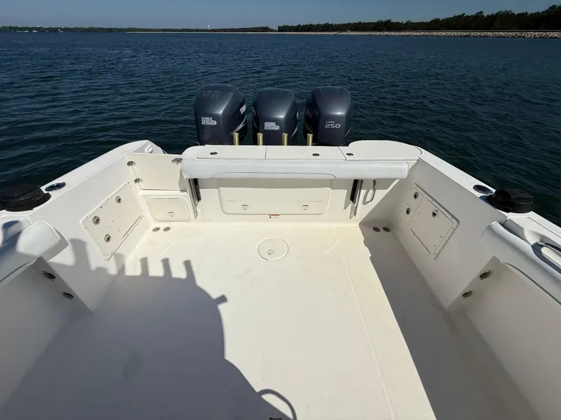 Slide: The Image of 2007 Wellcraft 352 Tournament boat with triple engines on open water. - 29