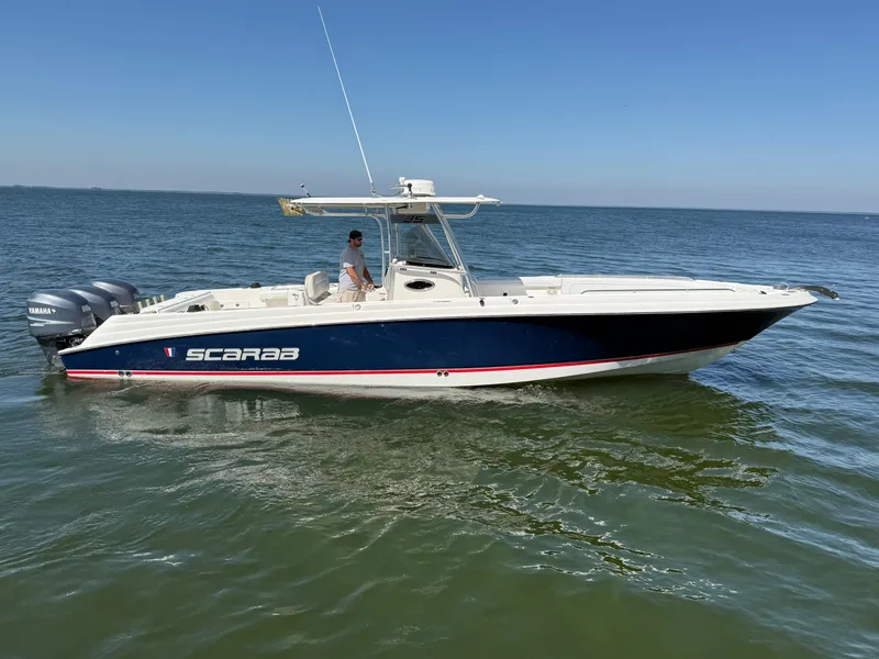 Slide: The Image of 2007 Wellcraft 352 Tournament boat on open water, side view. - 3